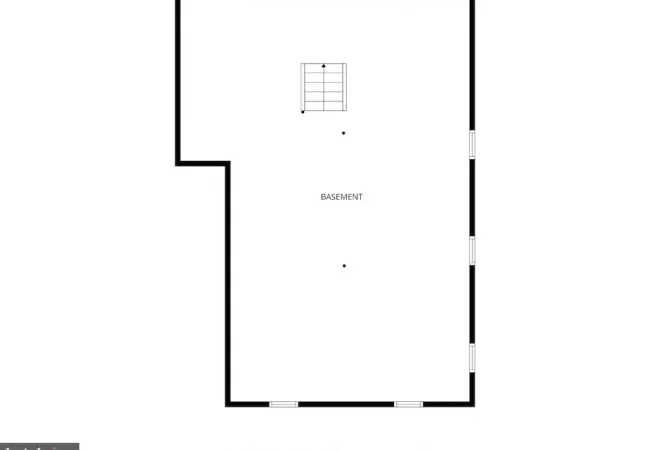 Basement floor plan: large rectangular room with a stairwell near the top center, an indentation on the left wall, and doors along the right wall.